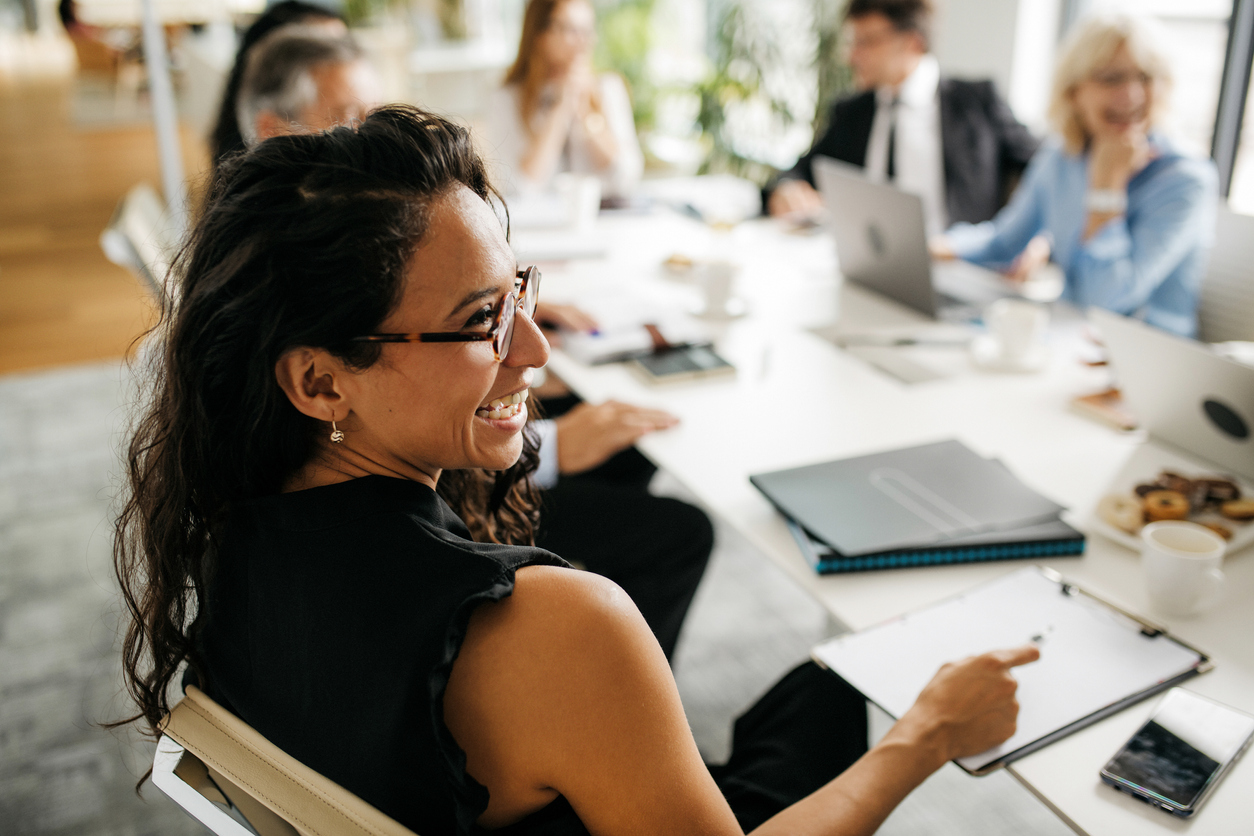 Candid Close-Up of Hispanic Businesswoman in Office Meeting